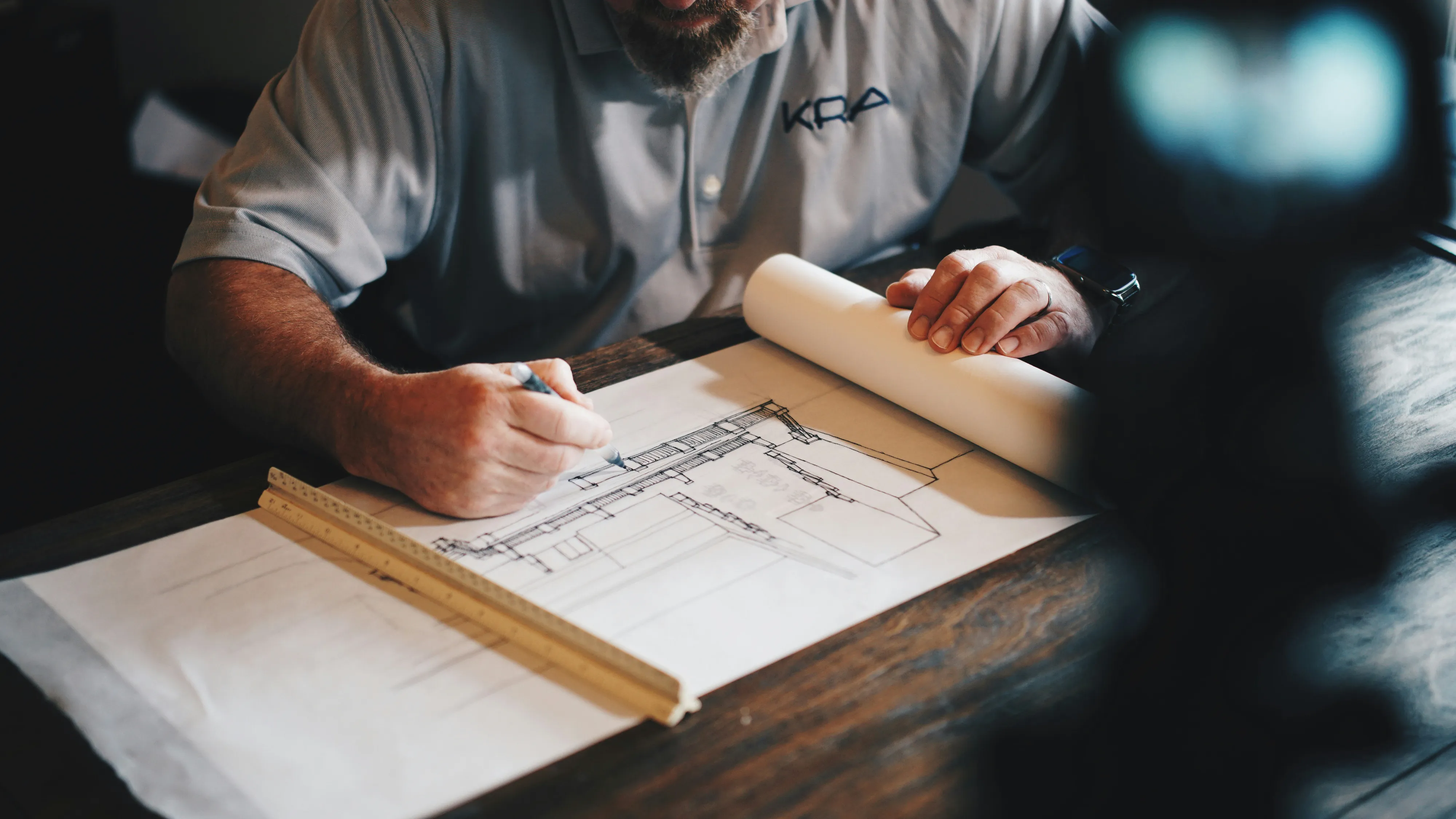 Hands reviewing a residential site plan